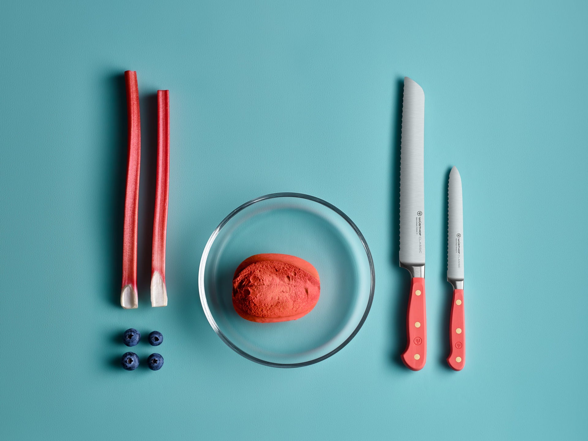 Classic color coral peach knives on teal background