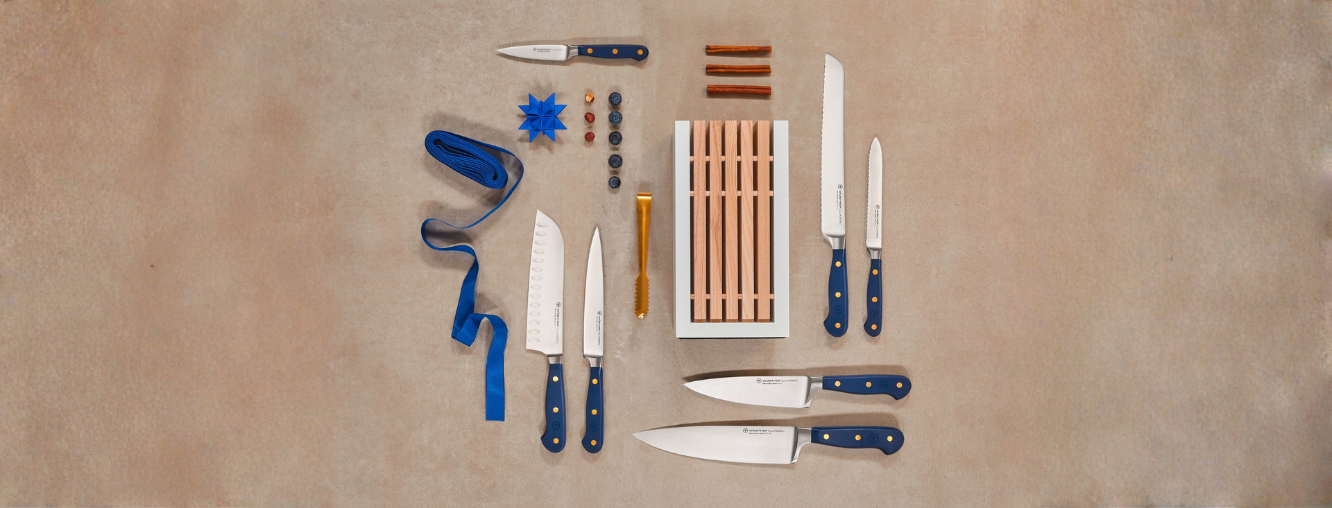 Collection of knives and cutting tools on a brown surface