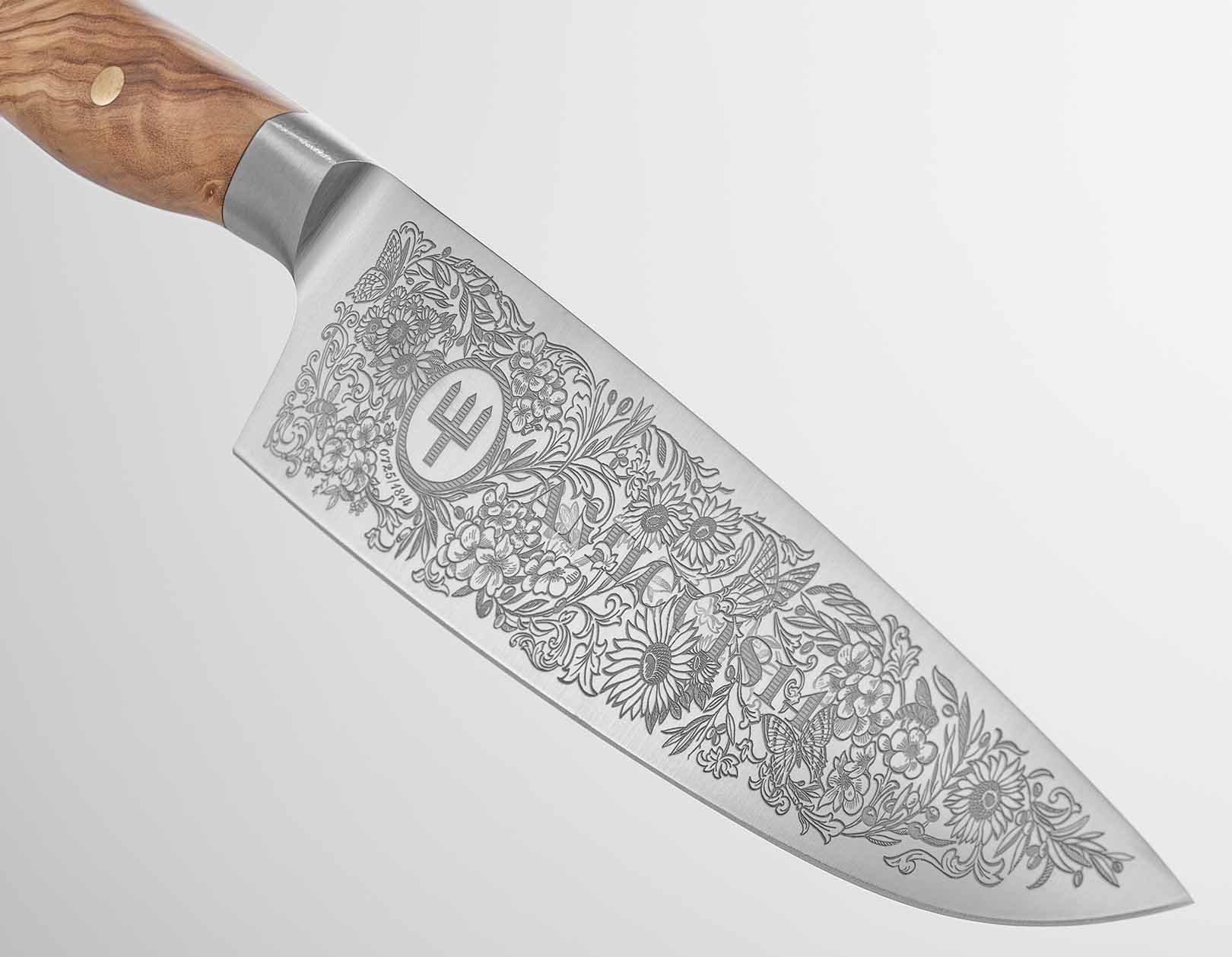 Decorative chef's knife with floral patterns on a white background