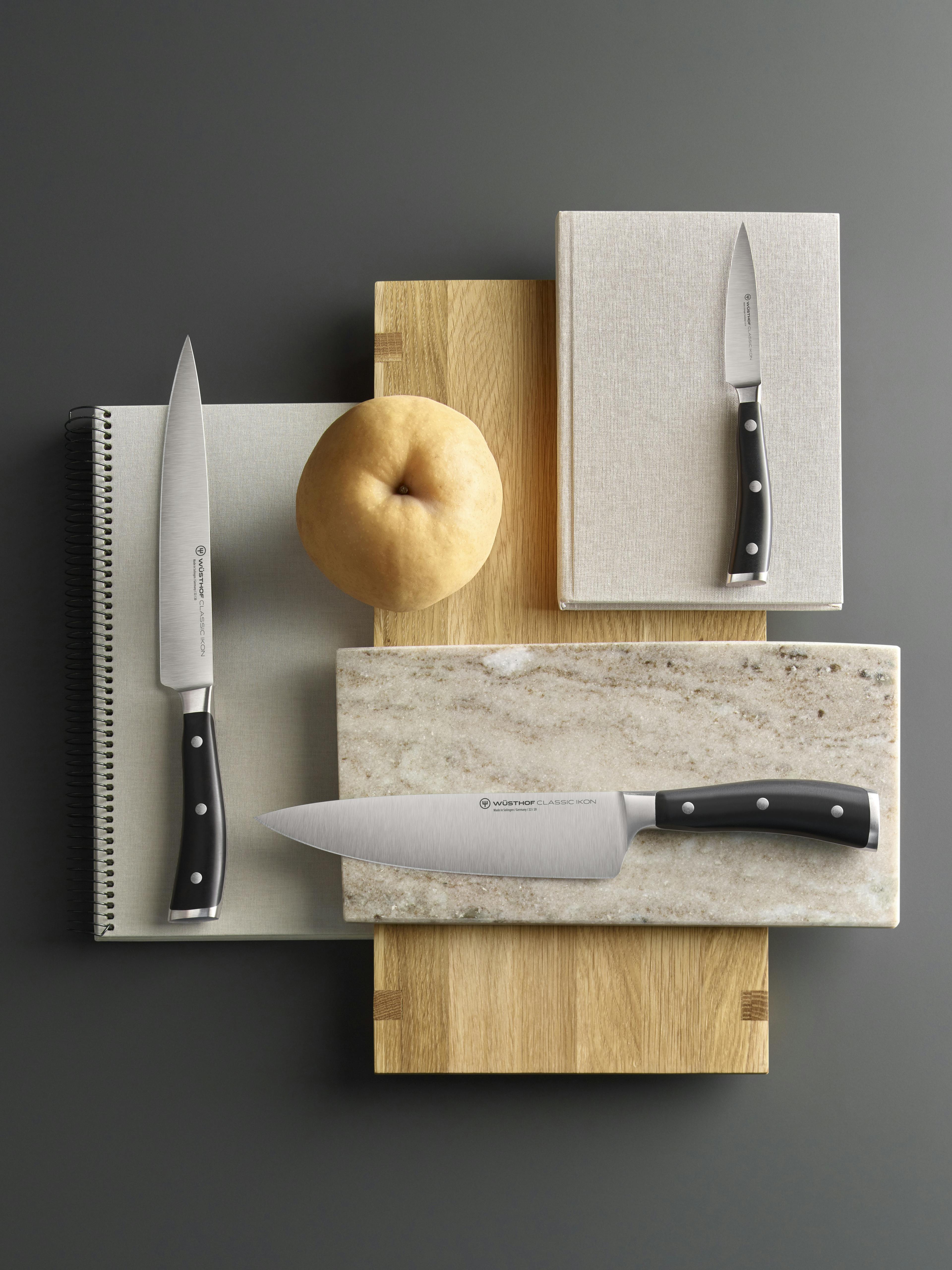 Classic Ikon Knives on cutting board layers